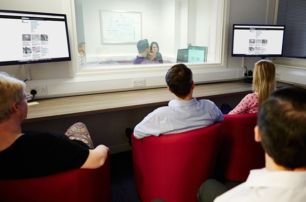 People watching and taking part in a usability session. 