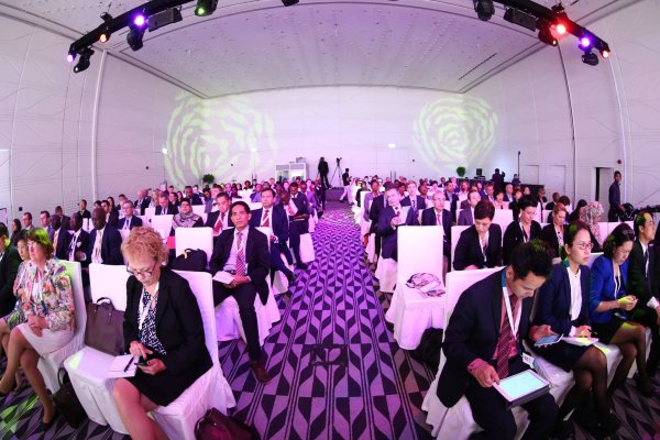 People sitting in the conference hall. 