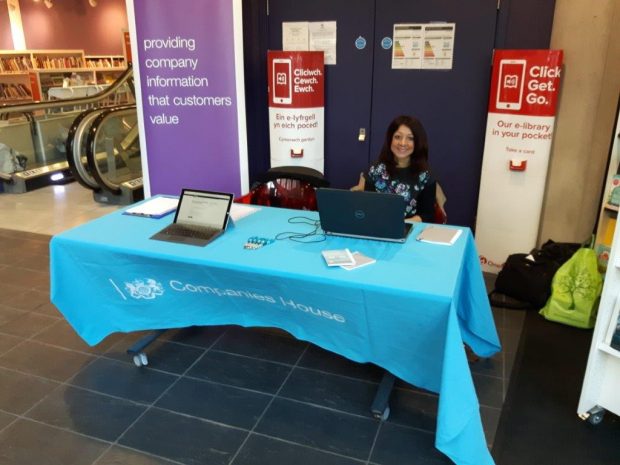 Amanda on a stall in library with a laptop