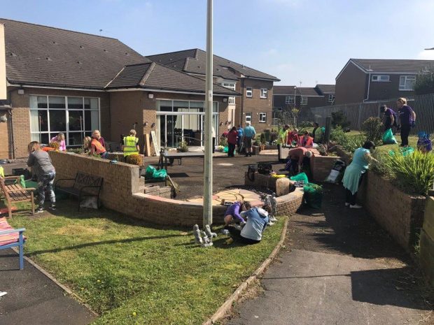 The team helping to clear the garden at Linden Court.