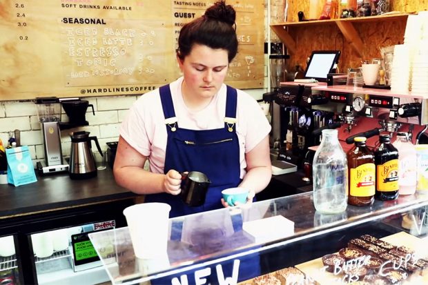 Serving a coffee at Hard Lines coffee shop.