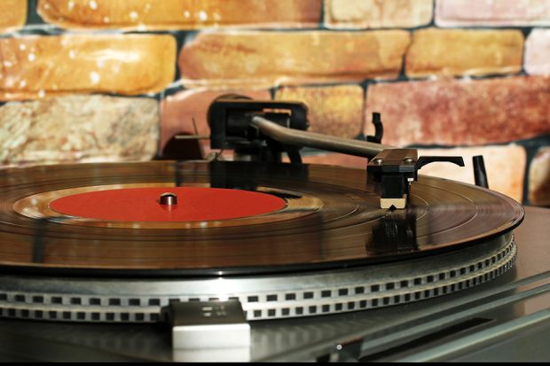 Turntable playing a vinyl record.