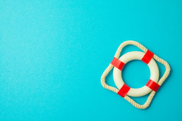 A red and white lifesaver against a blue background.