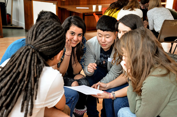 A group of young people talking at a volunteering event