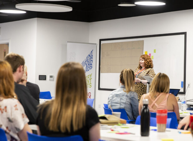 A person presenting their ideas at the unconference.