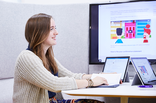 Imogen Percival, communications intern, working in a pod at Companies House