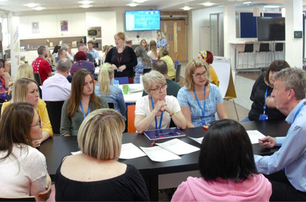 A group of people attending a meeting