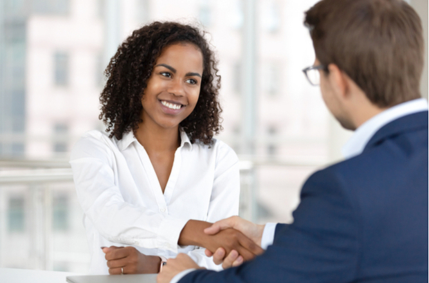 Two people shaking hands.